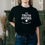 Woman wearing AW Truth Bombs Built from Fire Black T-shirt